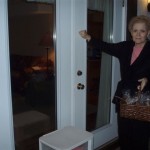 Linda gives out gifts to neighbors, along with church information